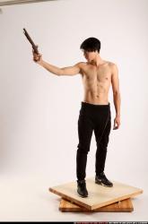 Man Young Athletic Fighting with rifle Standing poses Pants Asian