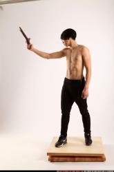 Man Young Athletic Fighting with rifle Standing poses Pants Asian