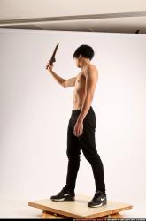 Man Young Athletic Fighting with rifle Standing poses Pants Asian