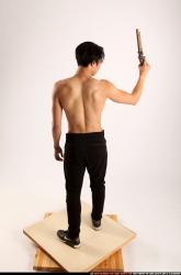 Man Young Athletic Fighting with rifle Standing poses Pants Asian