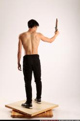 Man Young Athletic Fighting with rifle Standing poses Pants Asian