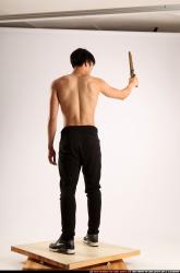 Man Young Athletic Fighting with rifle Standing poses Pants Asian