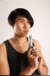 Man Young Athletic Fighting with gun Detailed photos Casual Asian