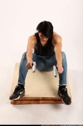 Man Young Athletic Fighting with gun Sitting poses Casual Asian