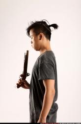 Man Young Athletic Fighting with gun Detailed photos Casual Asian