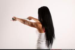 Woman Young Athletic Fighting with gun Standing poses Casual Latino