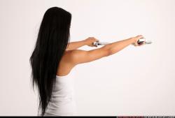 Woman Young Athletic Fighting with gun Standing poses Casual Latino