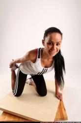 Woman Young Athletic Fitness poses Kneeling poses Sportswear Latino