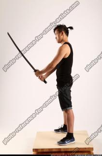 2014 12 JERALD MOB HOLDING KATANA DEFAULT POSE 02 B
