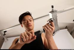 Man Young Athletic Reloading weapon Detailed photos Casual Asian