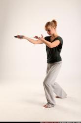 Woman Adult Athletic White Fighting with sword Standing poses Casual