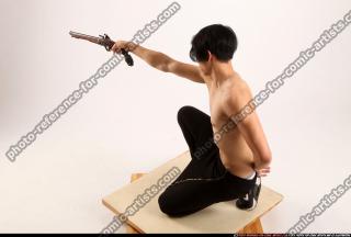 2015 02 KEIJI KNEELING AIMING FLINTLOCK 03 A