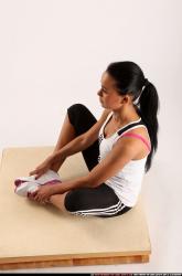 Woman Young Athletic Fitness poses Sitting poses Sportswear Latino