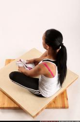 Woman Young Athletic Fitness poses Sitting poses Sportswear Latino