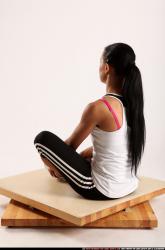 Woman Young Athletic Fitness poses Sitting poses Sportswear Latino