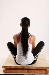 Woman Young Athletic Fitness poses Sitting poses Sportswear Latino