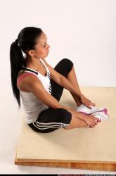 Woman Young Athletic Fitness poses Sitting poses Sportswear Latino