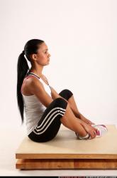 Woman Young Athletic Fitness poses Sitting poses Sportswear Latino