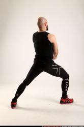 Man Adult Athletic White Fitness poses Standing poses Sportswear