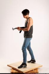 Man Young Athletic Fighting with submachine gun Standing poses Casual Asian