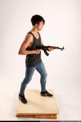 Man Young Athletic Fighting with submachine gun Standing poses Casual Asian