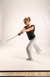 Woman Adult Athletic White Fighting with sword Standing poses Casual