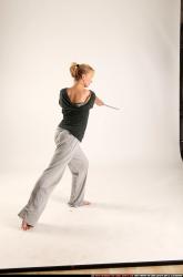 Woman Adult Athletic White Fighting with sword Standing poses Casual