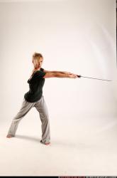 Woman Adult Athletic White Fighting with sword Standing poses Casual