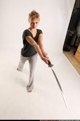 Woman Adult Athletic White Fighting with sword Standing poses Casual