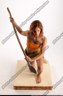 amy-prehistoric-kneeling-spear-attack