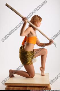 amy-prehistoric-kneeling-spear-attack