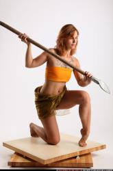 Woman Adult Athletic White Fighting with spear Kneeling poses Army