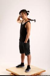 Man Young Athletic Fighting with submachine gun Standing poses Casual Asian