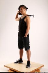 Man Young Athletic Fighting with submachine gun Standing poses Casual Asian