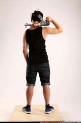 Man Young Athletic Fighting with submachine gun Standing poses Casual Asian