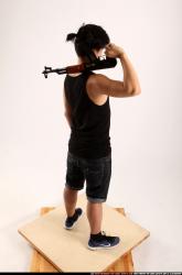 Man Young Athletic Fighting with submachine gun Standing poses Casual Asian