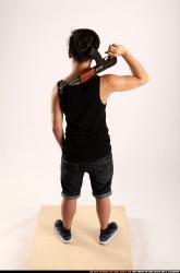 Man Young Athletic Fighting with submachine gun Standing poses Casual Asian