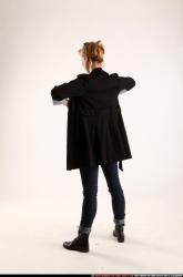 Woman Adult Athletic White Fighting with gun Standing poses Coat