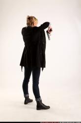 Woman Adult Athletic White Fighting with gun Standing poses Coat