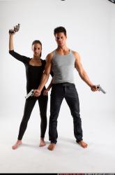 Man & Woman Adult Athletic White Fighting with gun Standing poses Casual