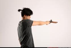 Man Young Athletic Fighting with gun Standing poses Casual Asian