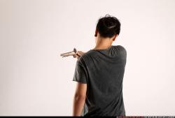 Man Young Athletic Fighting with gun Standing poses Casual Asian