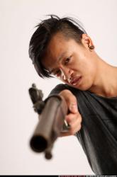 Man Young Athletic Fighting with gun Standing poses Casual Asian