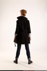 Woman Adult Athletic White Fighting with gun Standing poses Coat