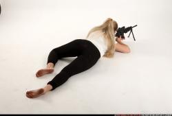 Woman Young Average Fighting with submachine gun Laying poses Casual Asian