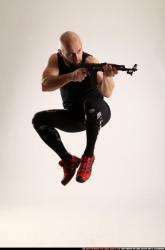 Man Adult Athletic White Fighting with submachine gun Moving poses Sportswear