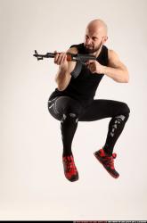 Man Adult Athletic White Fighting with submachine gun Moving poses Sportswear