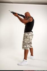 Man Adult Athletic Black Standing poses Sportswear Fighting with shotgun