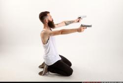 Man Adult Athletic White Fighting with gun Kneeling poses Casual