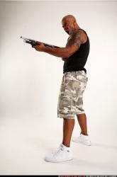 Man Adult Athletic Black Standing poses Sportswear Fighting with shotgun
